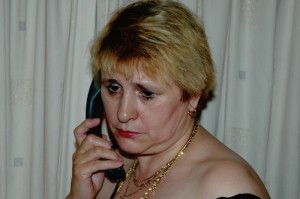 worried lady talking on phone