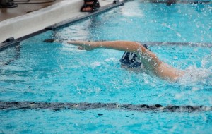 swimmer reaching for wall
