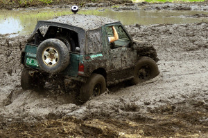 a jeep stuck in gooey mud