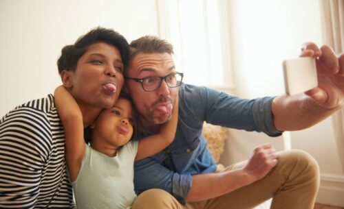 A family making faces for a silly photo