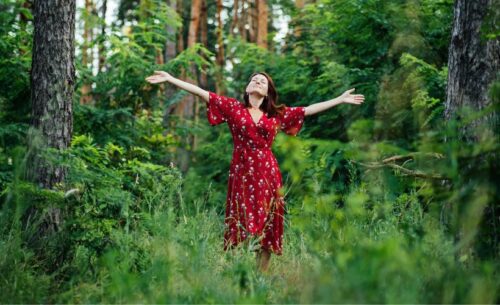 woman in forest with enthusiasm 